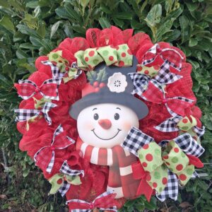 Red deco mesh Christmas wreath with black and white check and green polka-dot ribbons and a smiling snowman centrepiece – hand-made artificial wreath by Shamitay