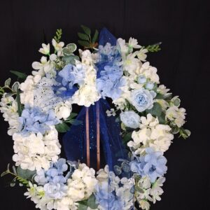Icy blue and white hydrangea wreath with pale blue roses and a sheer dark blue glitter ribbon – hand-made artificial wreath by Shamitay