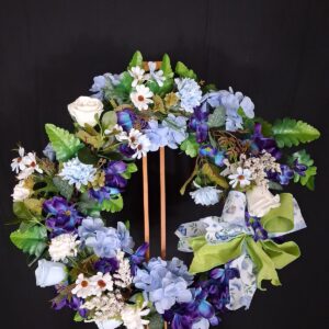 Blue and purple floral wreath with hydrangeas, purple pansies, white roses and a lime green butterfly bow – hand-made artificial wreath by Shamitay